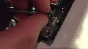 Unplug the fan's power cable by tugging on its wires.