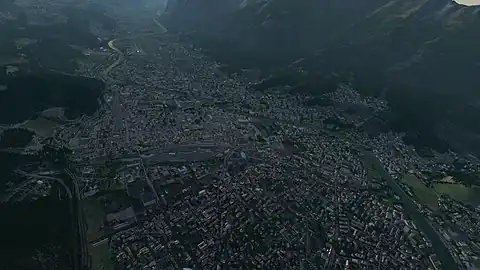 View over Innsbruck valley, Austria showing buildings, roads, and objects generated from OSM data. This is from the 1st build of OSM data for the entire world in FlightGear 2020 .