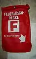 Verpackte Löschdecke, Wandmontage.