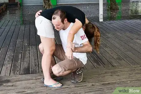 Image titled Do a Fireman's Carry Step 7