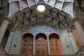 Wooden windows and wall carvings at the Borujerdi House.