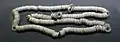 Strings of Western Han dynasty Wu Zhu (五銖) cash coins.