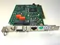 100 Mbit/s IBM Token Ring Management Adapter with Wake On LAN. Both UTP (RJ45) and STP (IBM Data Connector) interfaces are present.