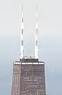 John Hancock Center in 1974, with the original stripped paint scheme visible on its antenna towers
