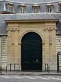Door between two pairs of Ionic pilasters in Paris