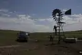 Checking a windmill on Spade Ranch summer range (ca. 2009)