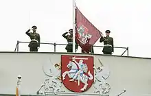 The presidential version of the coat of arms, as depicted on the Presidential Palace, and the Flag of the President of Lithuania