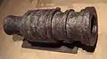 200&nbsp;kg wrought iron bombard, circa 1450, Metz, present-day France. It was manufactured by forging together iron bars, held in place by iron rings. It fired 6&nbsp;kg stone balls. Length: 82&nbsp;cm.