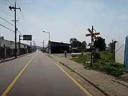 Level crossing near the former Eocheon Station.mw-parser-output .geo-default,.mw-parser-output .geo-dms,.mw-parser-output .geo-dec{display:inline}.mw-parser-output .geo-nondefault,.mw-parser-output .geo-multi-punct{display:none}.mw-parser-output .longitude,.mw-parser-output .latitude{white-space:nowrap}37°14′58″N 126°54′39″E﻿ / ﻿37.24944°N 126.91083°E﻿ / 37.24944; 126.91083