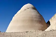 Exterior of yakhchal in Meybod, Iran with shade wall