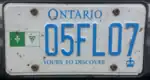 Personalized plate bearing the image of the Franco-Ontarian flag. Uncommonly for this pattern, the marketing legend is in English.
