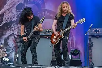 Sami Yli-Sirniö (right) performing with Kreator