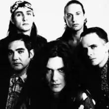 Caifanes in 1990Top: Alfonso André&nbsp;[es] and Alejandro Marchovich&nbsp;[es]Bottom:Sabo Romo, Saúl Hernández and Diego Herrera&nbsp;[es]