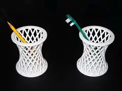 3D-printed dual-use pen/toothbrush holder-cup. Printed on Ultimaker 2, 2015.