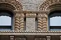 Detail of the terracotta facade elements on the seventh floor