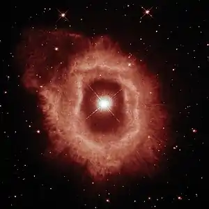This image showcases the details of the ionised hydrogen and ionised nitrogen emissions from the nebula (seen here in red).
