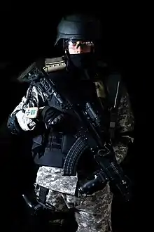 An Indian CRPF QRT operator with a Bulgarian AR-M1F41 modified with Israeli FAB Defense accessories