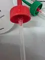 A hole  wash bottle lids necessary for acetone and methanol.