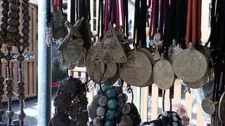 Agimat or anting-anting talismans, traditionally believed to grant certain powers. Typical motifs are esoteric symbols inspired primarily by Christian iconography.