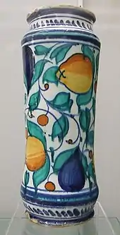 An albarello (drug jar) from Venice or Castel Durante, 16th century. Approx 30&nbsp;cm high. Decorated in cobalt blue, copper green, antimony yellow, and yellow ochre. Burrell Collection