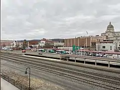 Four AMTRAN buses pause at the Altoona Transportation Center's bus platform. Altoona Metro Transit covers the maintenance costs for this part of the facility.