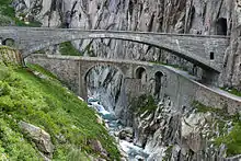The modern concrete span of the third Devil's Bridge (Teufelsbrücke, built 1958) showing an older bridge (built 1830) below.