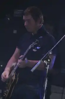 Nicholson performing with the Arctic Monkeys in 2006