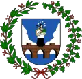 A coat of arms depicting a brown bridge rising up out of a blue body of water into a blue sky with white clouds