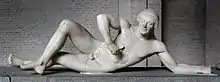 Attributed by some to Onatas or his school: Fallen Trojan warrior, figure W-VII of the west pediment of the Temple of Aphaia, Glyptothek, Munich, ca. 505–500 BC