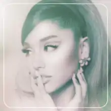 A monochrome portrait of Ariana Grande touching her face, looking to her right. The image consists only of white and blue green hues, framed by a white border with rounded corners. At the bottom of the picture stands the album title "POSITIONS", printed in white letters.
