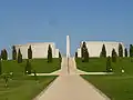 A general view of the memorial, which commemorates service men and women killed since 1945. The two curved walls and two straight walls are made from bricks covered with Portland stone panels. At the centre of the Memorial are two bronze sculptures created by Ian Rank-Broadley. This memorial remembers over 16000 people who has been killed or sacrificed their lives while on duty or targeted by terrorists or they died on operational theatre for us. Their names have been written in a panel for us to remember their significance in the Armed Forces.