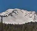 The instance an avalanche is triggered due to excess snow build up
