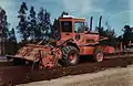 A Bomag MPH100 soil stabilizer aerating the soil ready for blending with lime