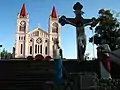 The cathedral from the stairs with the large Calvary at the terminus of the stone stairs.