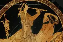 Party musicians are often associated with prostitution. Bottom painting of a bowl from Attica, with red clay figures on a black background. The author is the so-called Painter of Colmar, circa 480 BC. The Louvre Museum.