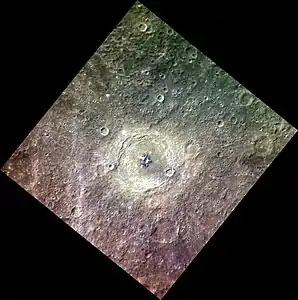 Approximate color image of Bartók at a high sun angle showing that the central peak is much darker than the floor and ejecta of the crater, with some areas that are much brighter