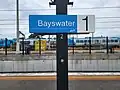 Platform 1 sign in November 2022. The Bayswater maintenance depot can be seen in the background.