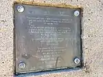 Close-up of a plaque on a stone monument