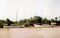 Two working bedars (both about 45' LOD) waiting for the season to sail up to Thailand on a salt run, Terengganu, 1980