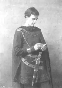 young clean shaven white man in 16th century costume