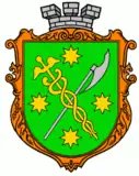 Vert bordure or, a caduceus or and an axe argent saltirewise, four octagrams or in chief, in base and in fess, and overall surmounted by a mural crown argent.