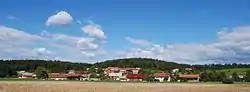 View of Bistrica from the rail line from Sevnica to Trebnje south of the village
