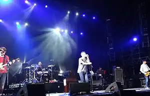 Blur performing live in 2013. From left to right: Graham Coxon, Dave Rowntree, Damon Albarn and Alex James