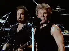 Shanks (left) performing with Bon Jovi in 2017.