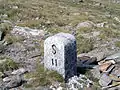 Border stone at Passo San Giacomo between Val Formazza&nbsp;[it] in Italy and Val Bedretto&nbsp;[it] in Switzerland