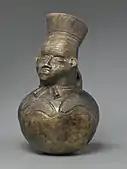 Anthropomorphic pot; early 20th century; pottery; 40.0 × 24.0&nbsp;cm (15.mw-parser-output .frac{white-space:nowrap}.mw-parser-output .frac .num,.mw-parser-output .frac .den{font-size:80%;line-height:0;vertical-align:super}.mw-parser-output .frac .den{vertical-align:sub}.mw-parser-output .sr-only{border:0;clip:rect(0,0,0,0);clip-path:polygon(0px 0px,0px 0px,0px 0px);height:1px;margin:-1px;overflow:hidden;padding:0;position:absolute;width:1px}3⁄4 × 9.mw-parser-output .frac{white-space:nowrap}.mw-parser-output .frac .num,.mw-parser-output .frac .den{font-size:80%;line-height:0;vertical-align:super}.mw-parser-output .frac .den{vertical-align:sub}.mw-parser-output .sr-only{border:0;clip:rect(0,0,0,0);clip-path:polygon(0px 0px,0px 0px,0px 0px);height:1px;margin:-1px;overflow:hidden;padding:0;position:absolute;width:1px}1⁄2 in.); by Mangbetu people; Brooklyn Museum (New York City)