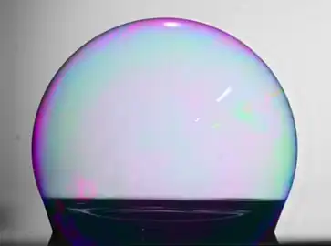 A soap bubble wetting an ultrahydrophobic surface