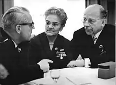 East German politicians wearing horn rimmed glasses, cat eye glasses, and wire rimmed glasses, late 1960s.