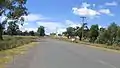 The railway level crossing and turnoff to Mudgee via Wollar, just north of the village of Bylong