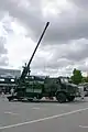 On display, side profile of deployed howitzer